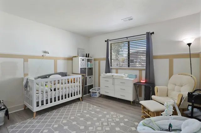 a bed room with furniture and windows