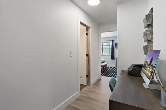 a bedroom with a bed and a table