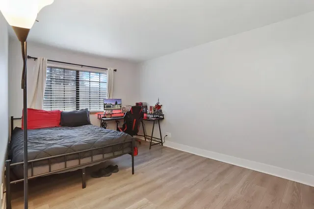 a room with a dresser and a window