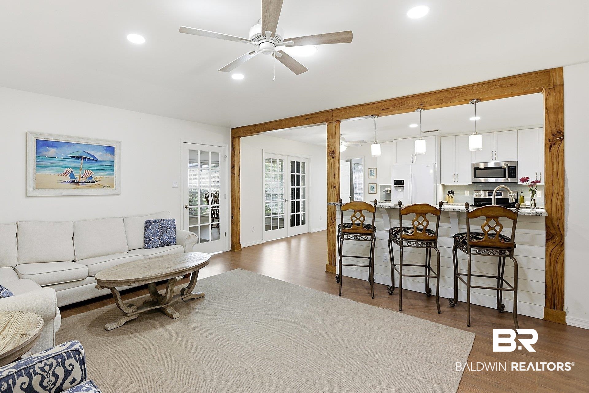 25793 Bonito Avenue Orange Beach, AL 36561 - Photo 9 of 27 Custom wooden beam/columns between the kitchen and living area