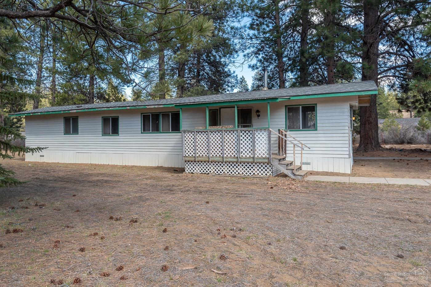 59936 Cheyenne Road Bend, OR 97702 - Photo 2 of 23 Beautiful tall pine trees surround the h