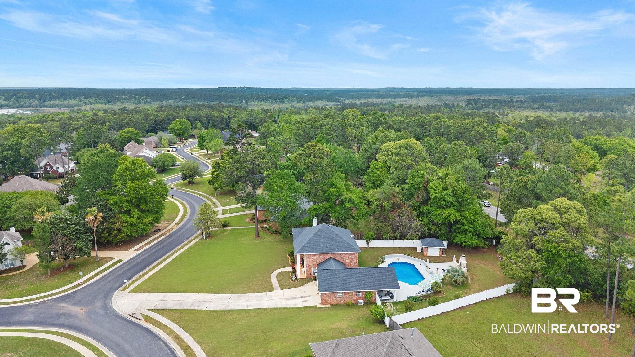 2 Speckle Trout Route Daphne, AL 36527 - Photo 55 of 61 Aerial view of a forest and a pool area