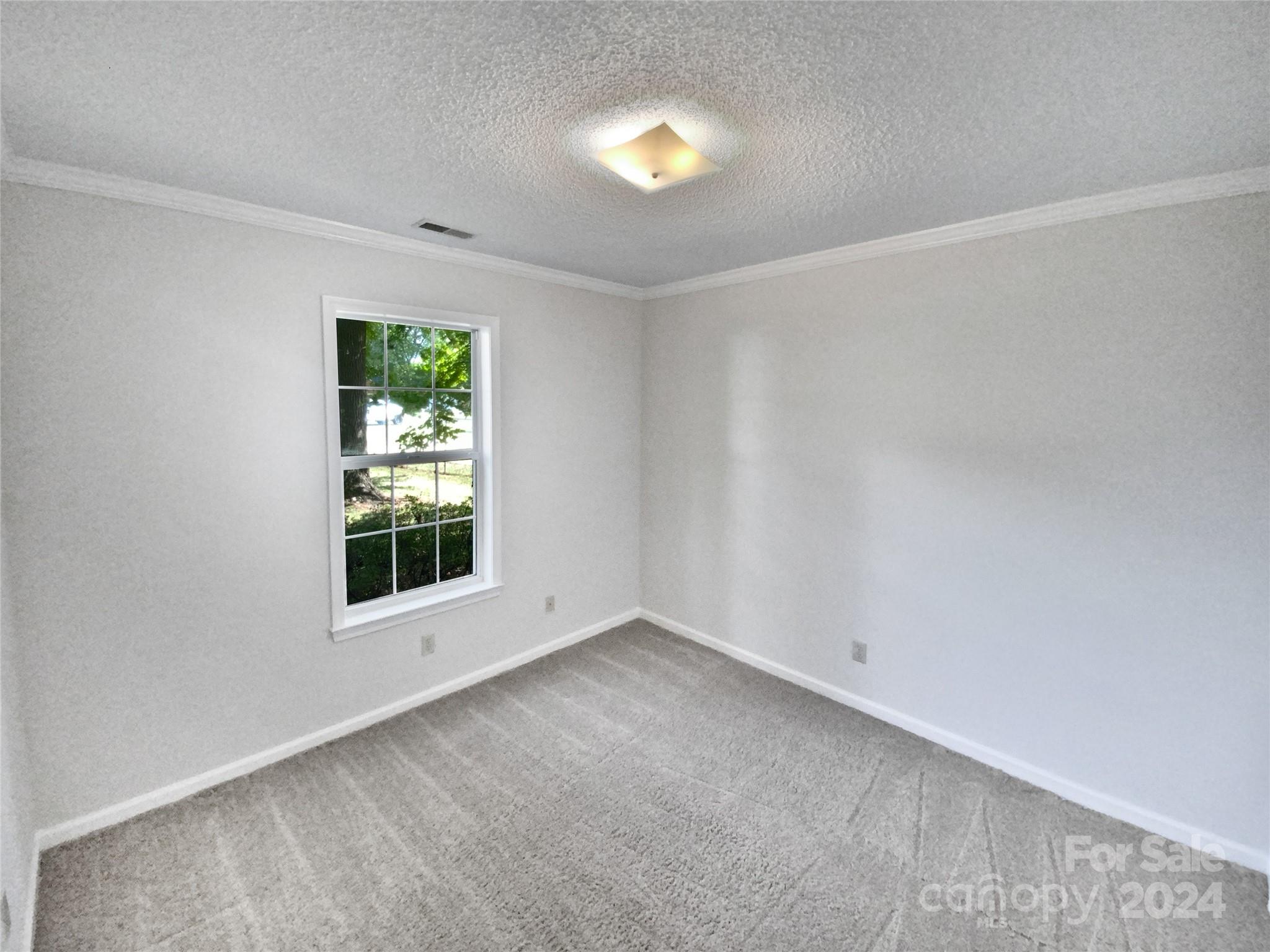 1150 Phillip Street Salisbury, NC 28147 - Photo 14 of 22 an empty room with a window and mirror