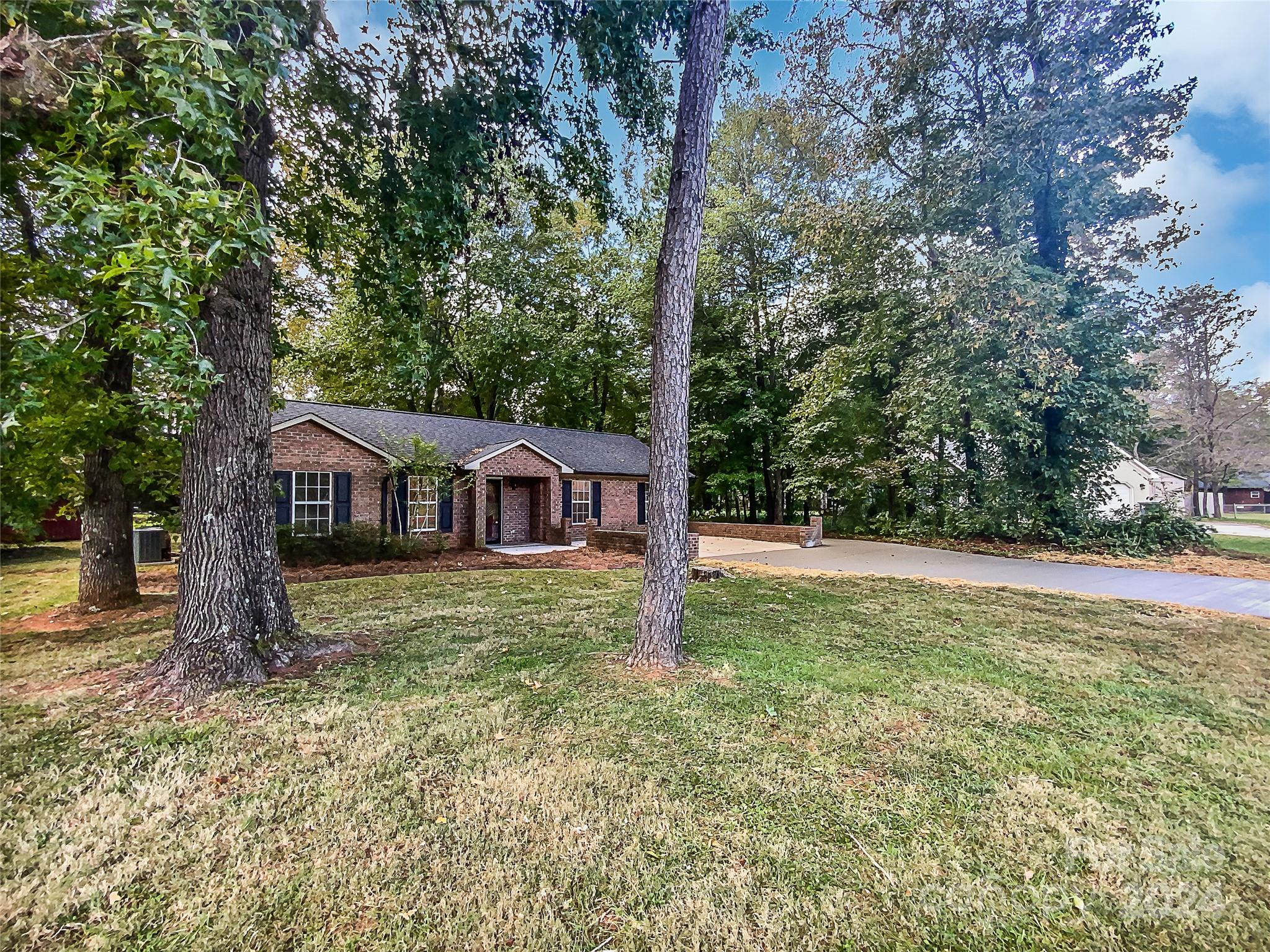 1150 Phillip Street Salisbury, NC 28147 - Photo 18 of 22 a view of a house with a yard and large trees