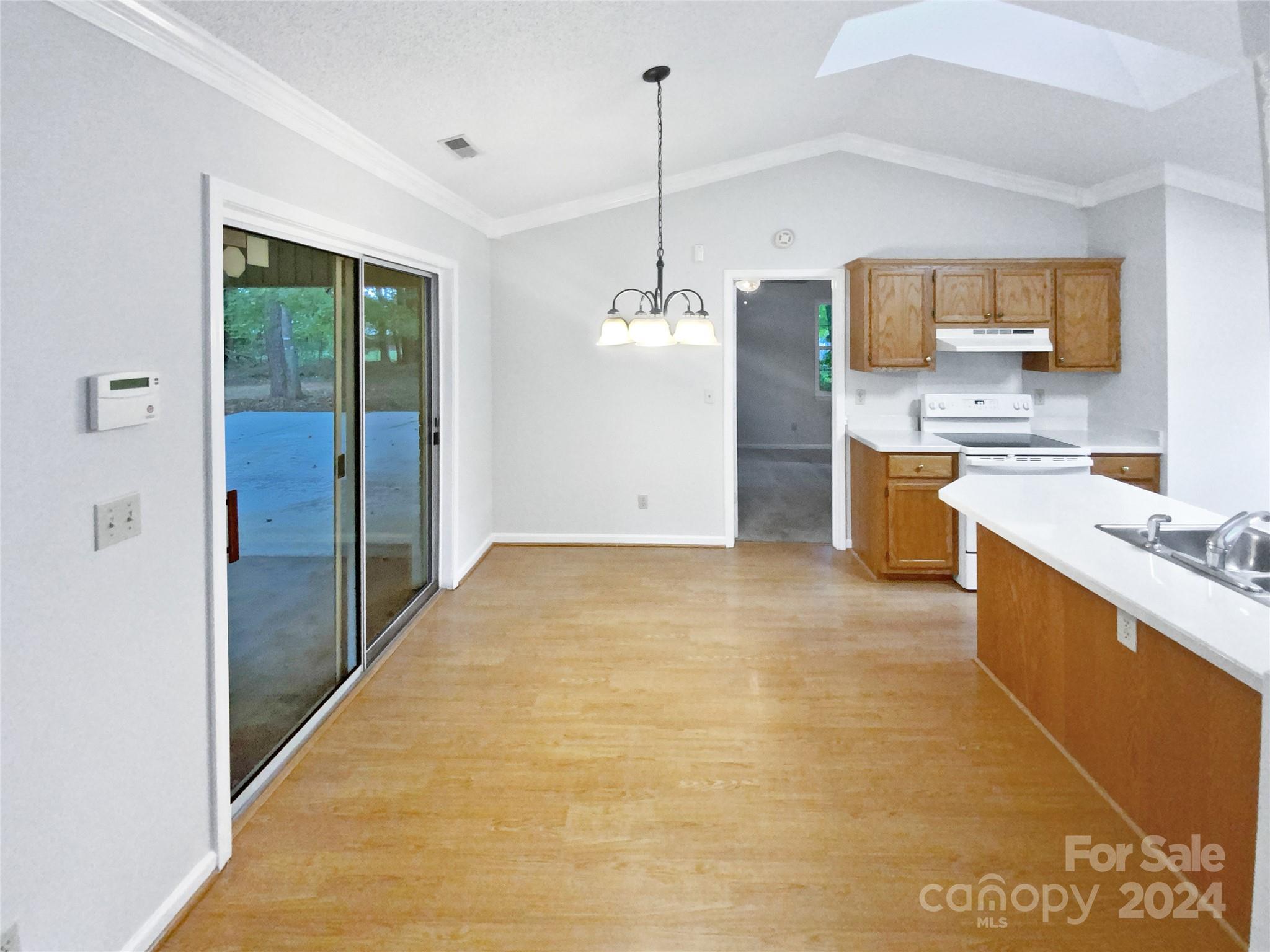 1150 Phillip Street Salisbury, NC 28147 - Photo 10 of 22 a large white kitchen with stainless steel appliances granite countertop a sink and cabinets