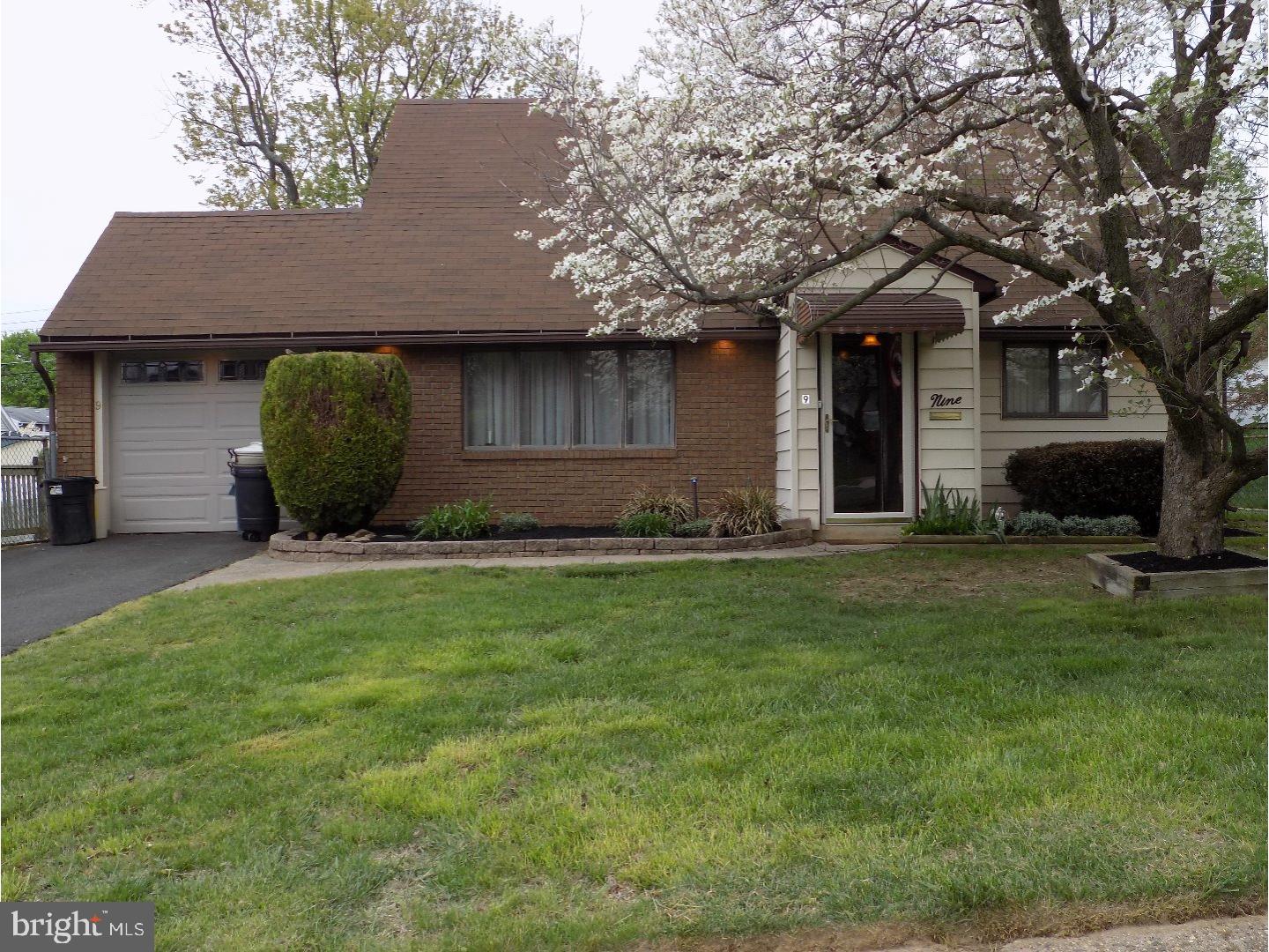 9 Circle Road Levittown, PA 19057 - Photo 1 of 22 a front view of a house with a garden