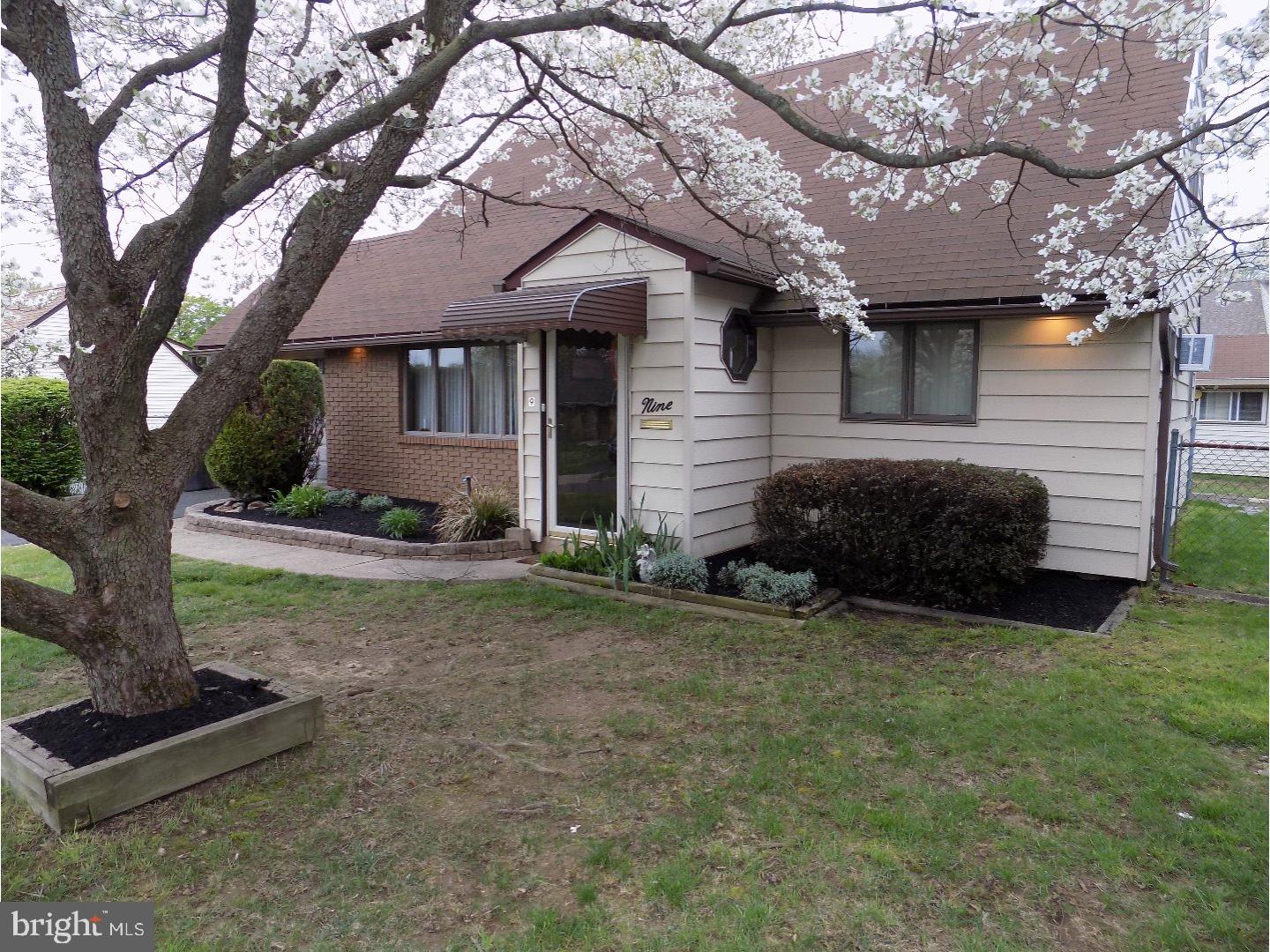 9 Circle Road Levittown, PA 19057 - Photo 3 of 22 a view of a house with a yard and a large tree