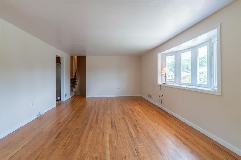 200 Foxcroft Road Pittsburgh, PA 15220 - Photo 13 of 43 an empty room with wooden floor and windows