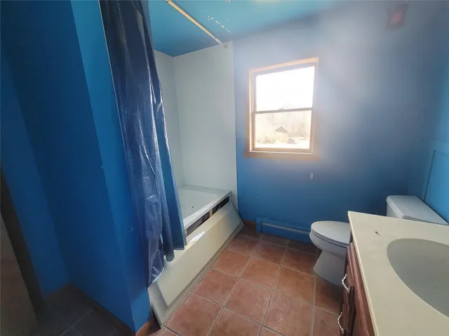 a bathroom with a toilet and a sink