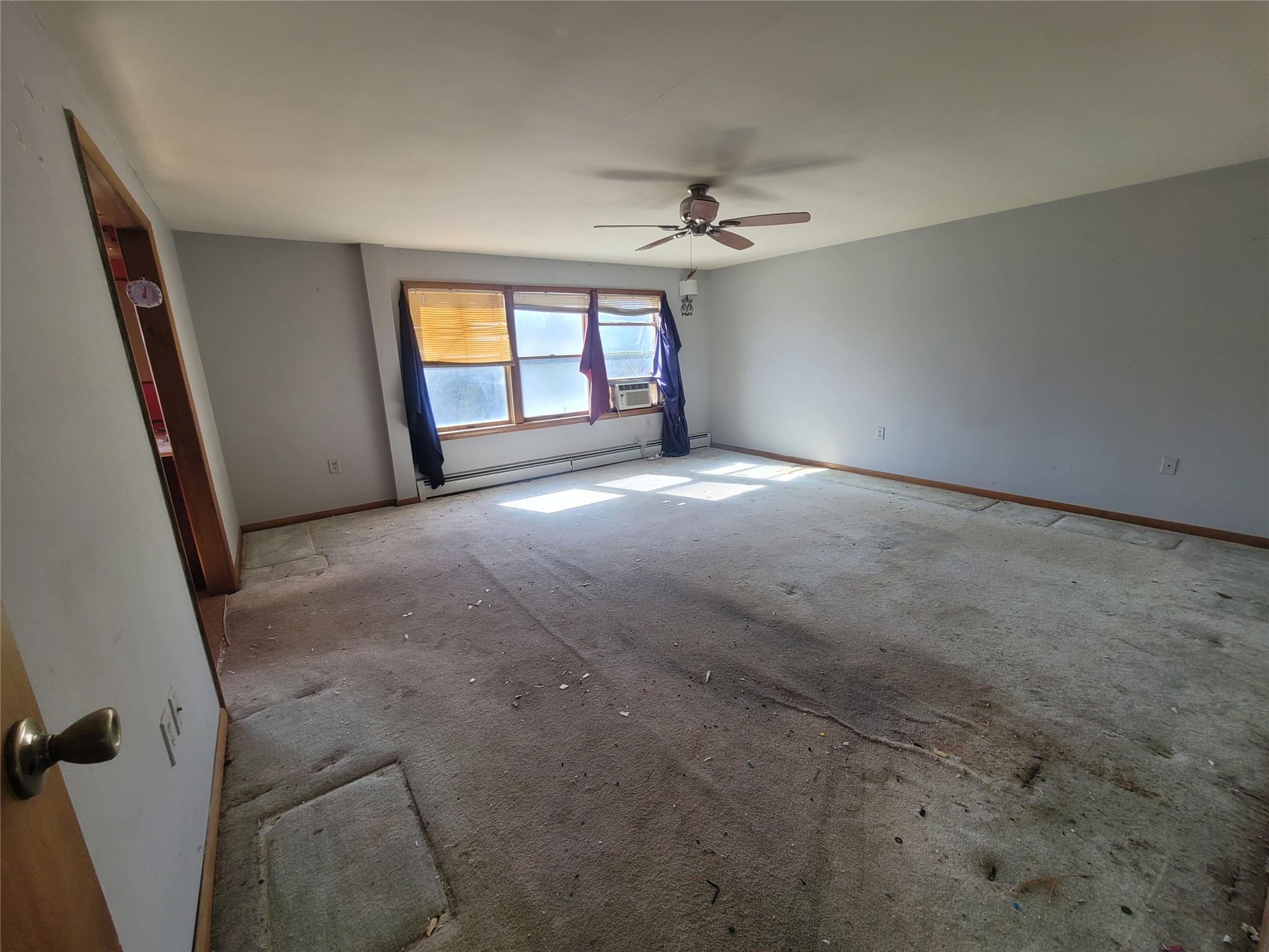 26 Rolling Meadows Road Livingston Manor, NY 12758 - Photo 13 of 19 an empty room with windows and fan