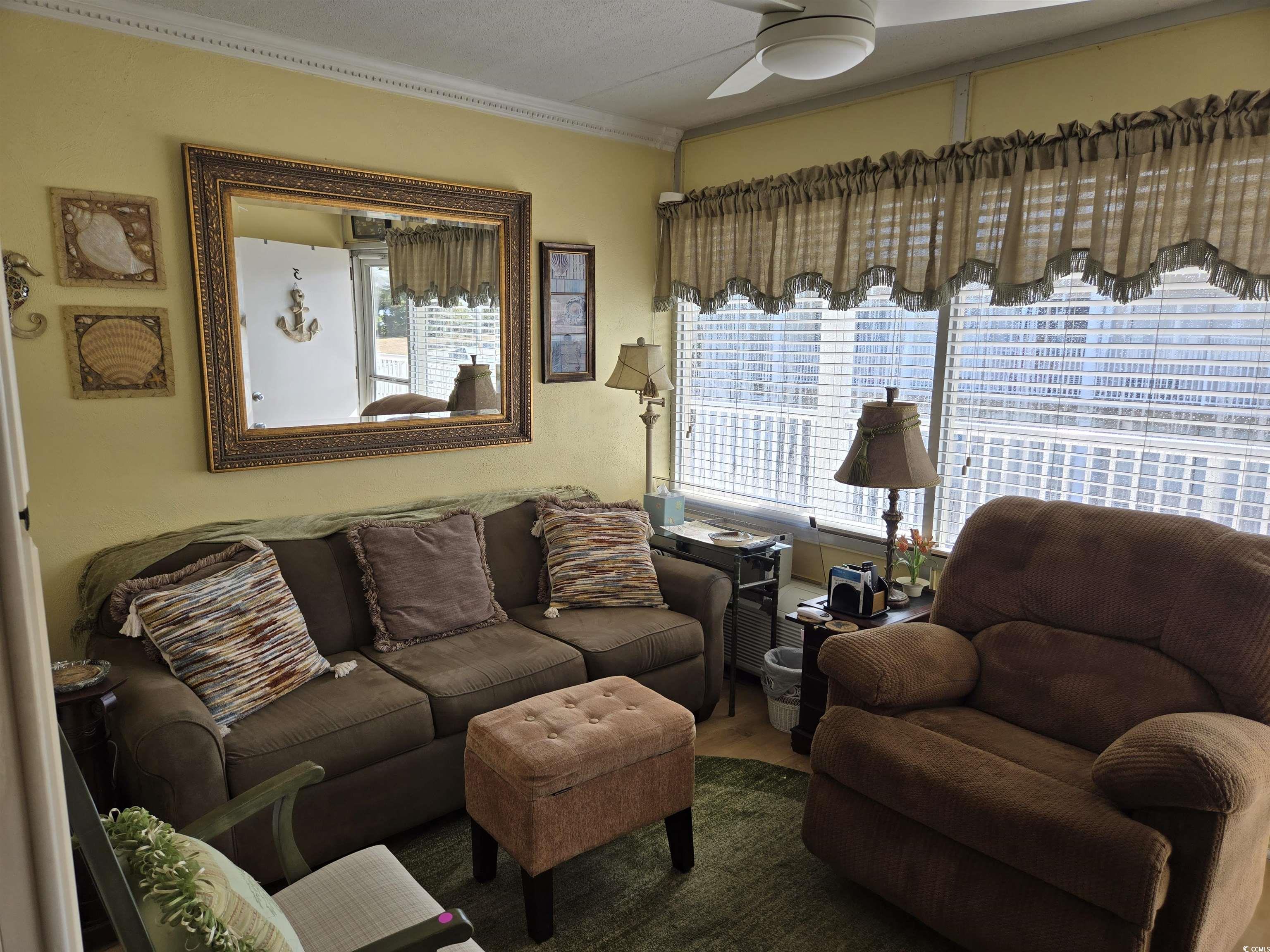2204 Perrin Drive, Unit 3 North Myrtle Beach, SC 29582 - Photo 19 of 39 Living room with ceiling fan and crown molding