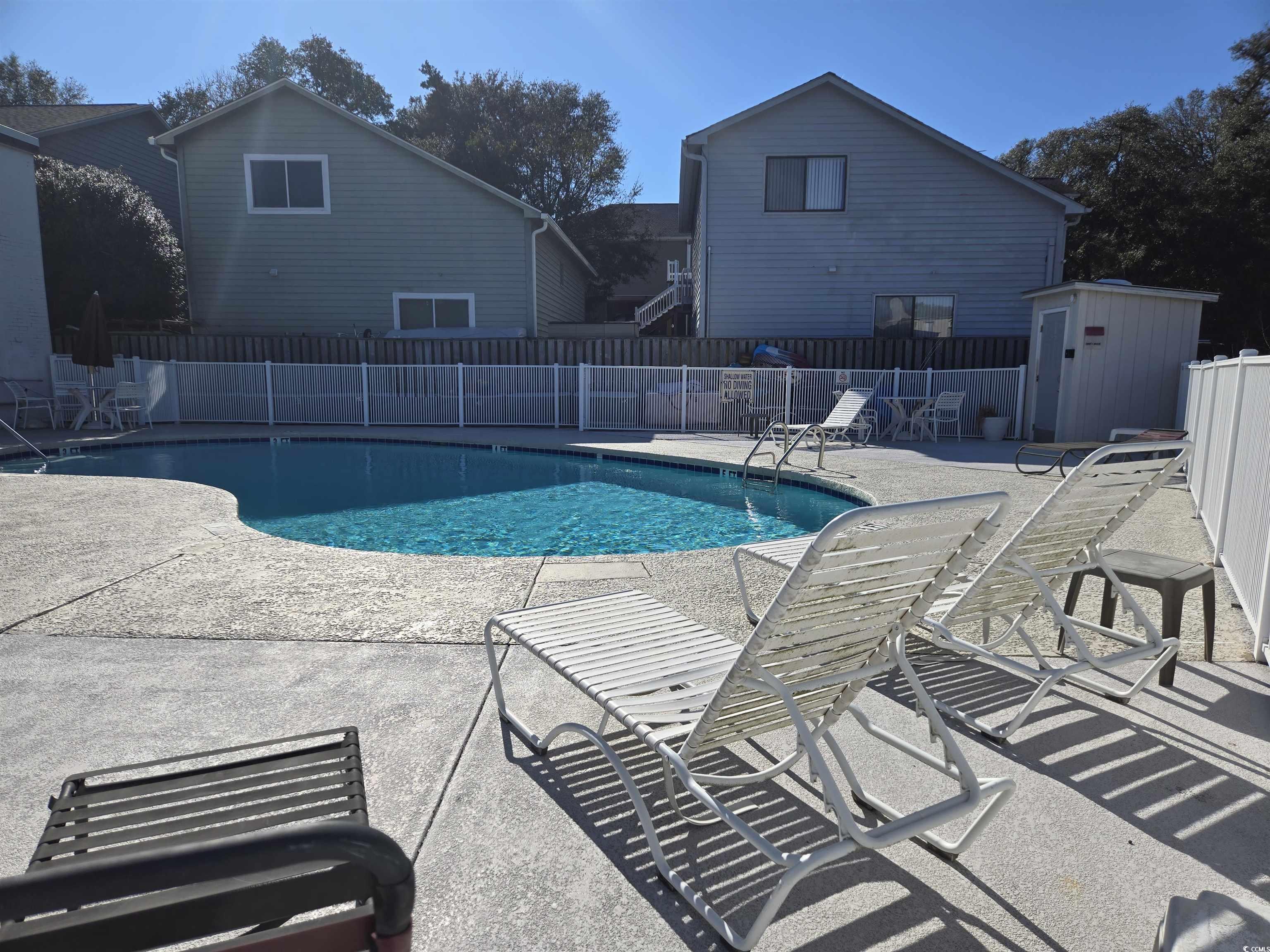 2204 Perrin Drive, Unit 3 North Myrtle Beach, SC 29582 - Photo 10 of 39 View of swimming pool with a patio area