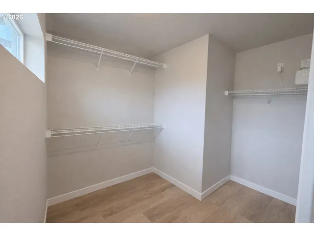 a view of an empty walk in closet