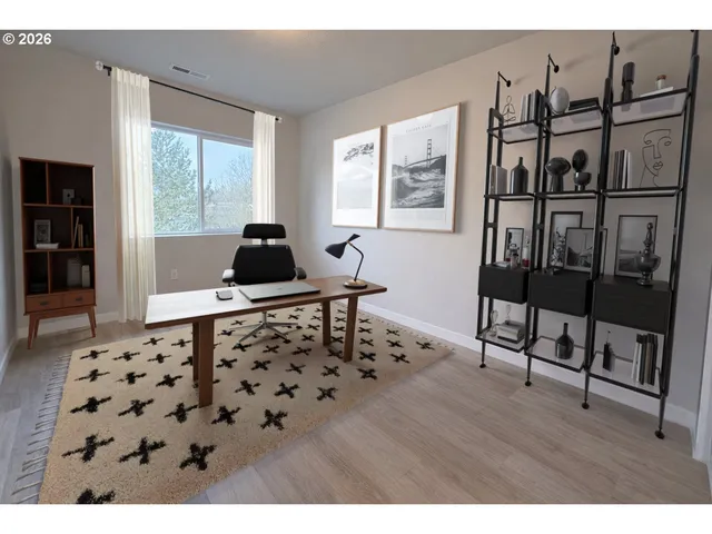 a living room with furniture window and wooden floor
