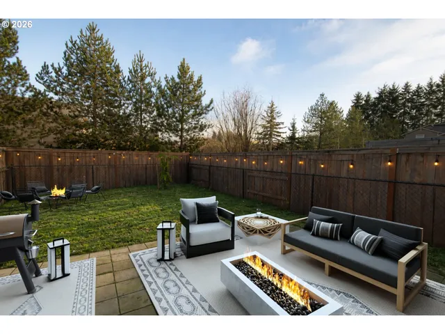 a view of sitting area with furniture in the backyard