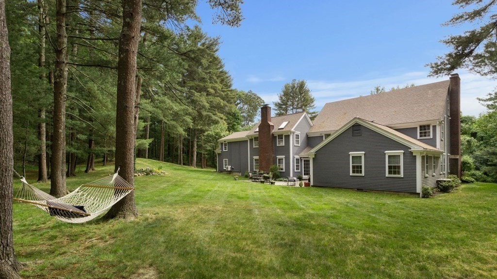 18 Pine Street Dover, MA 02030 - Photo 20 of 20 a view of a house with a yard and large tree