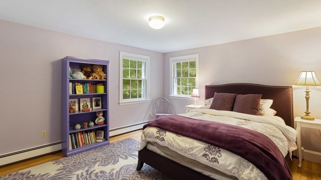 18 Pine Street Dover, MA 02030 - Photo 10 of 20 a bedroom with a bed a dresser and a book shelf