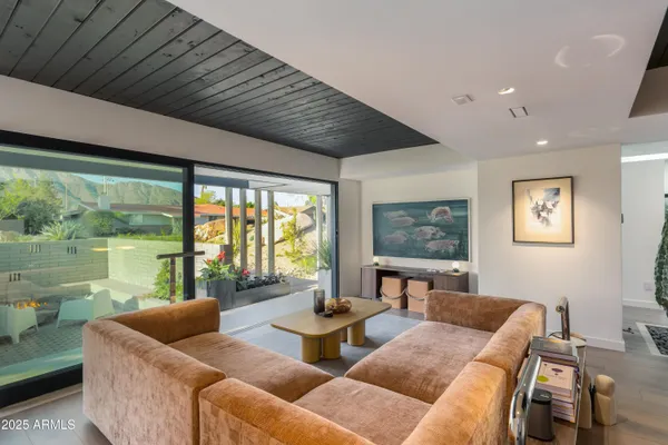 a living room with furniture and a large window