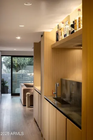 a kitchen with stainless steel appliances a sink a stove and a refrigerator