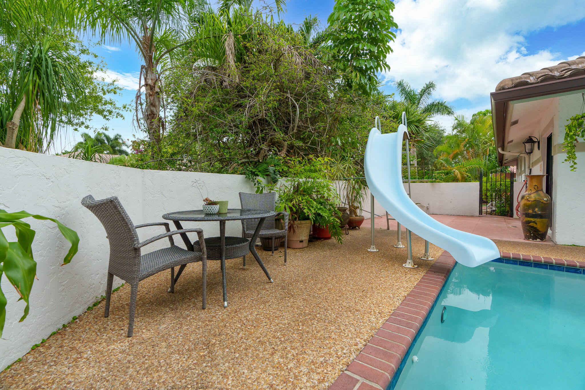 2801 Northwest 27th Avenue Boca Raton, FL 33434 - Photo 54 of 60 Pool Slide with Lounge Area