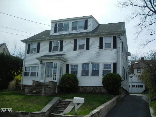 43 Chesterfield Road Stamford, CT 06902 - Photo 1 of 1 a front view of a house with garden