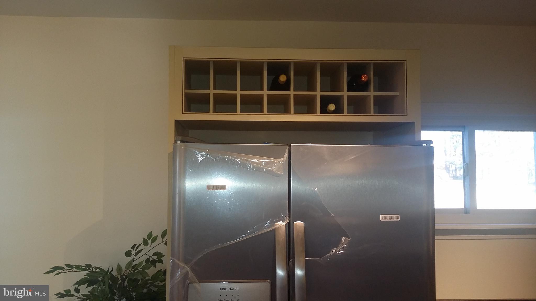 1061 Dr Jack Road Conowingo, MD 21918 - Photo 6 of 35 Wine rack over new stainless steel refrigerator