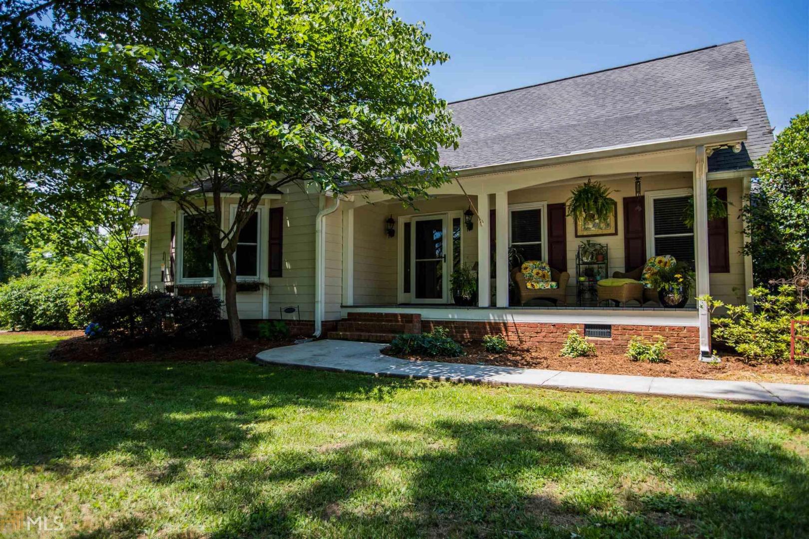 271 Kellett Road Northeast Rome, GA 30165 - Photo 1 of 1 a view of a house with sitting area and garden