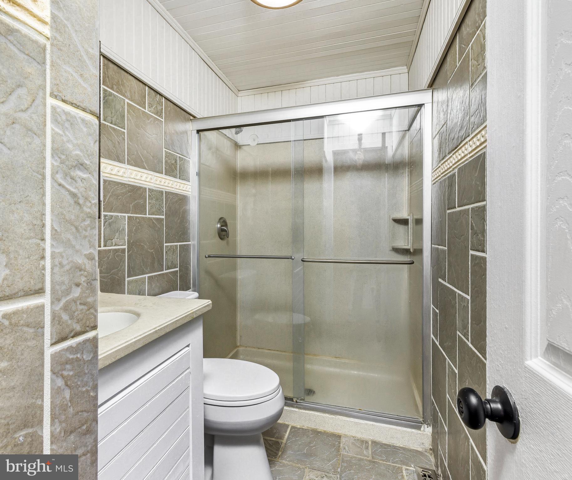 300 Turnersville Road Pine Hill, NJ 08021 - Photo 14 of 22 a bathroom with a shower a toilet and a sink