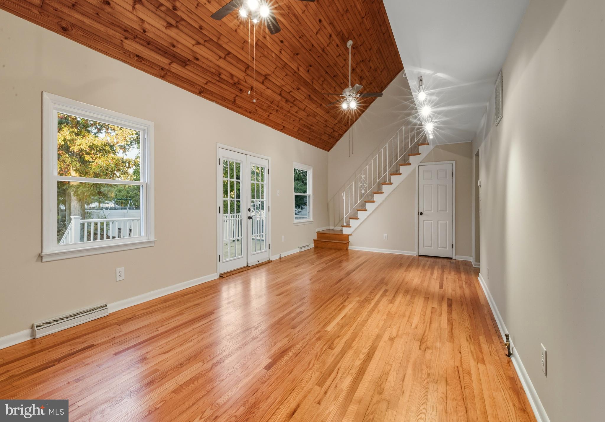 300 Turnersville Road Pine Hill, NJ 08021 - Photo 5 of 22 a view of an empty room with wooden floor and a window