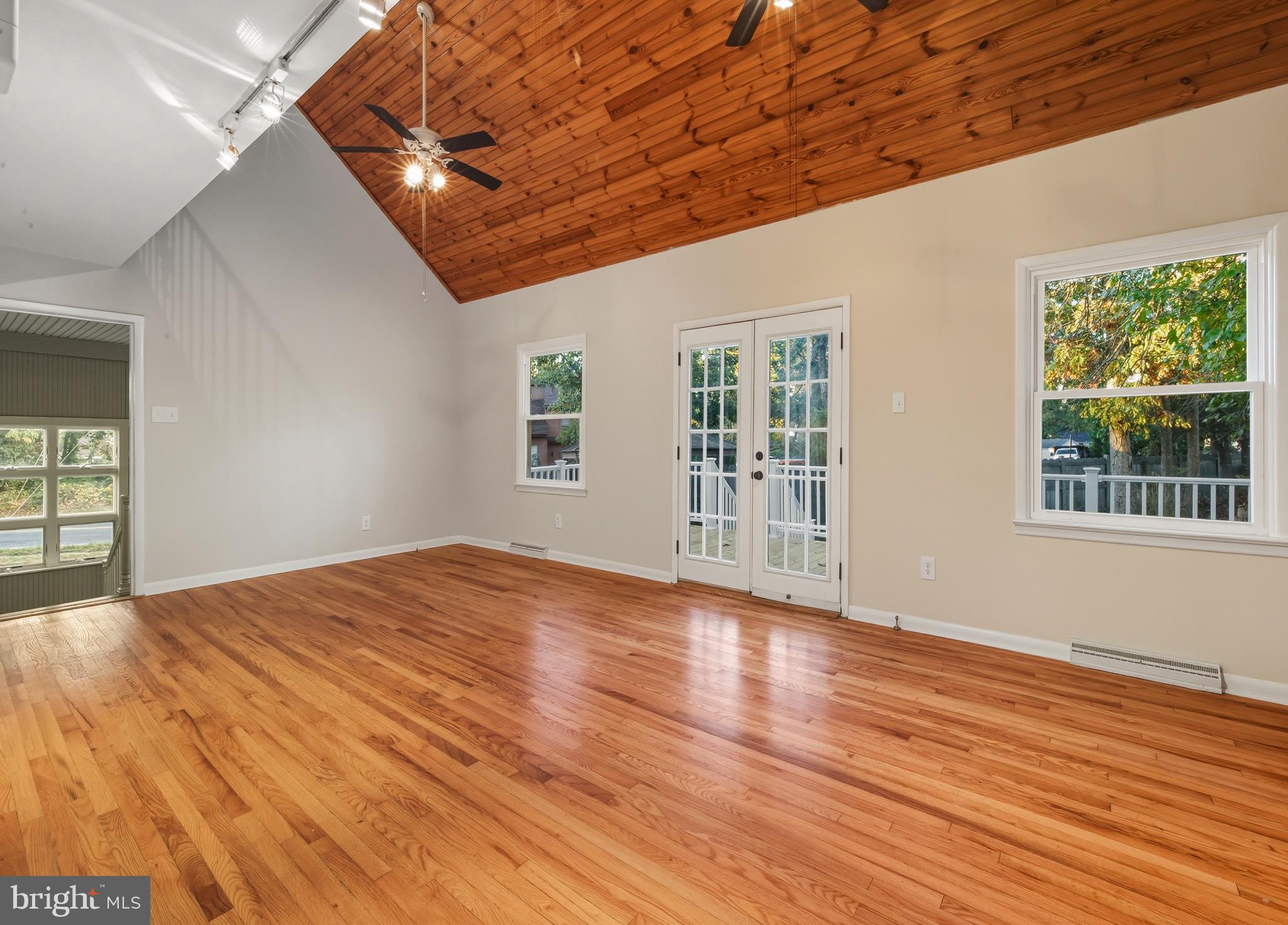 300 Turnersville Road Pine Hill, NJ 08021 - Photo 6 of 22 a view of an empty room with wooden floor and a window