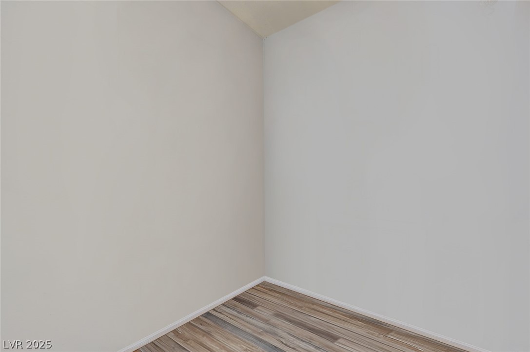 2305 West Horizon Ridge Parkway, Unit 1223 Henderson, NV 89052 - Photo 11 of 28 Empty room featuring light wood finished floors and baseboards