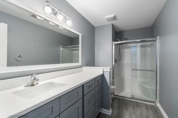 a bathroom with a sink double vanity and a mirror