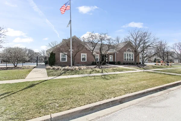 a picture of a bench in front of a wall