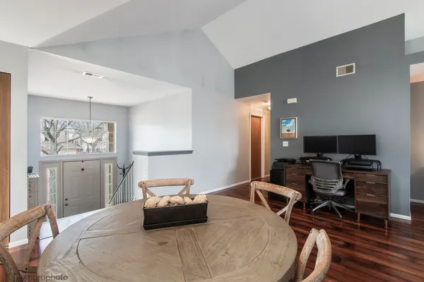 a bedroom with furniture and a flat screen tv