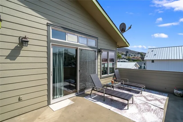 a view of a dining area with furniture and chandelier
