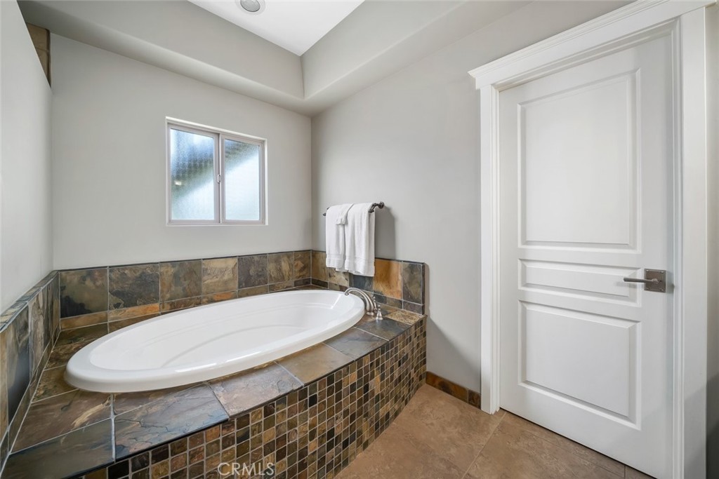 159 Ash Avenue Cayucos, CA 93430 - Photo 24 of 44 a bathroom with a sink a mirror and a toilet