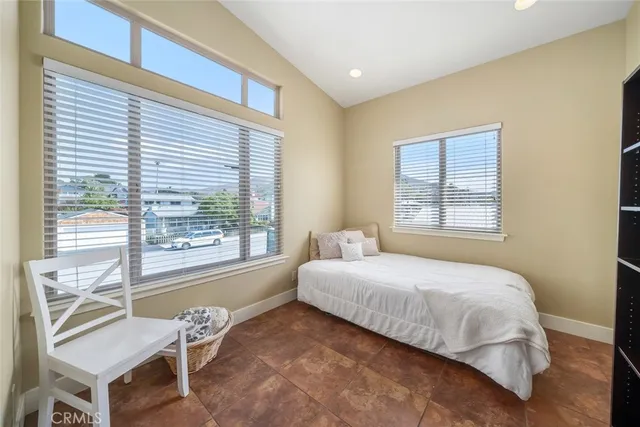 a view of a hallway view with wooden floor and a living room