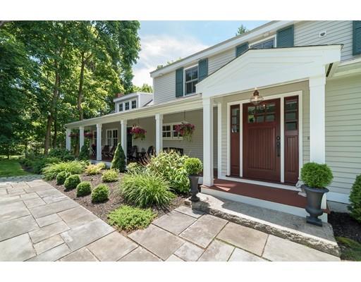 1073 Bay Road Hamilton, MA 01982 - Photo 5 of 36 a front view of a house with garden