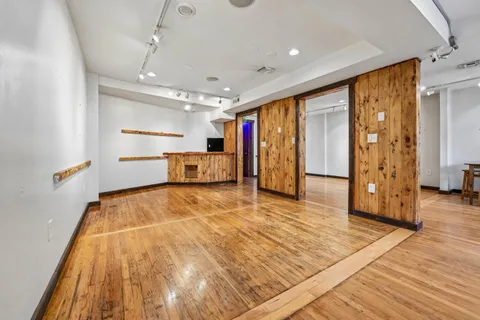 a kitchen with stainless steel appliances a sink and a refrigerator