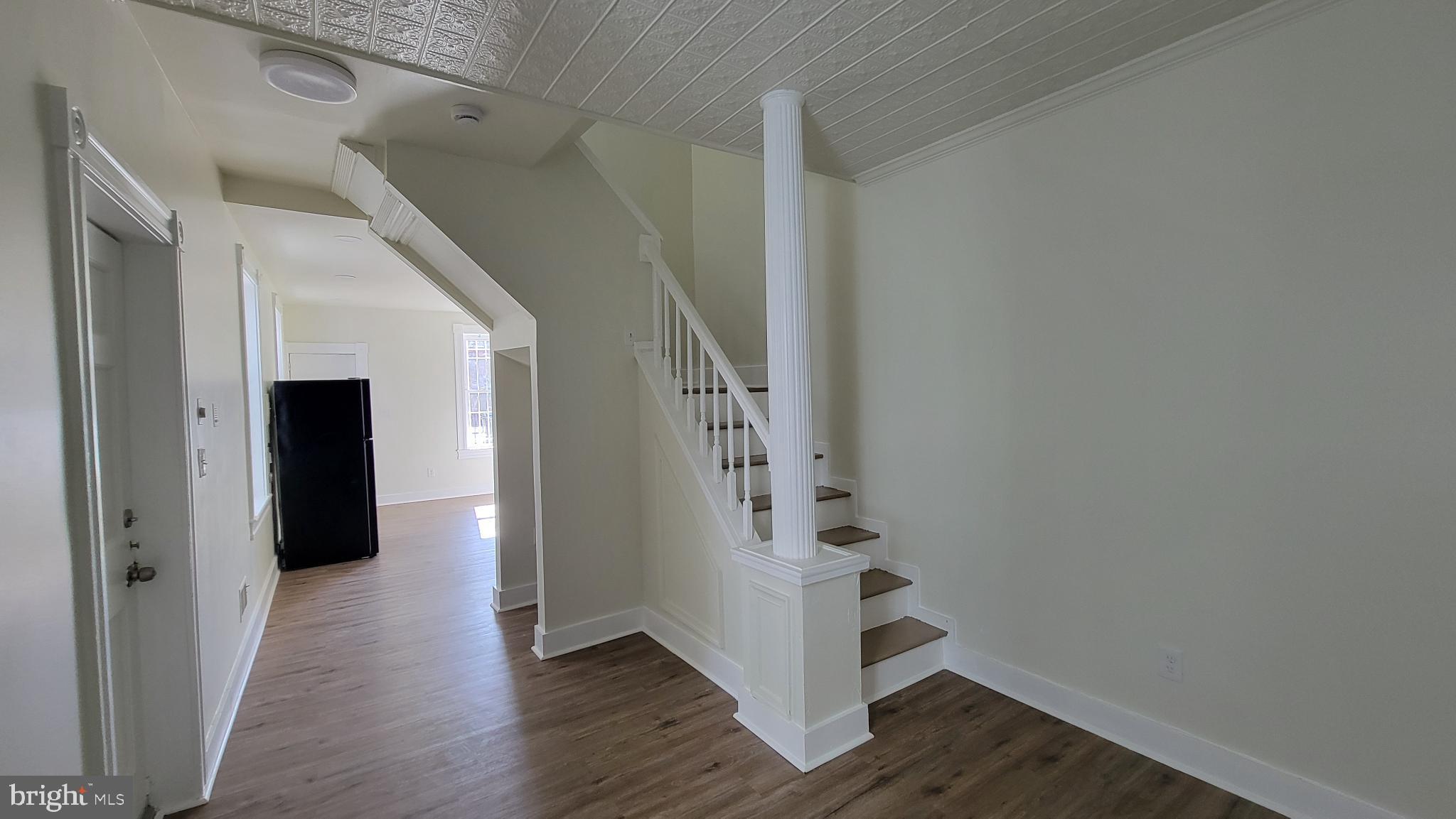 637 South Paca Street, Unit B Baltimore, MD 21230 - Photo 3 of 5 Bright and airy entryway with elegant stairs.