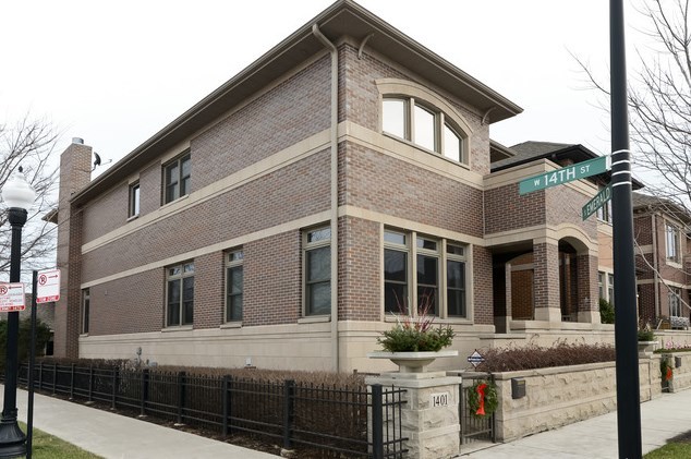 a view of a white house with large windows