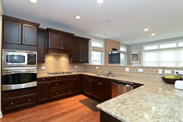 1401 South Emerald Avenue Chicago, IL 60607 - Photo 6 of 12 a kitchen with a sink and cabinets