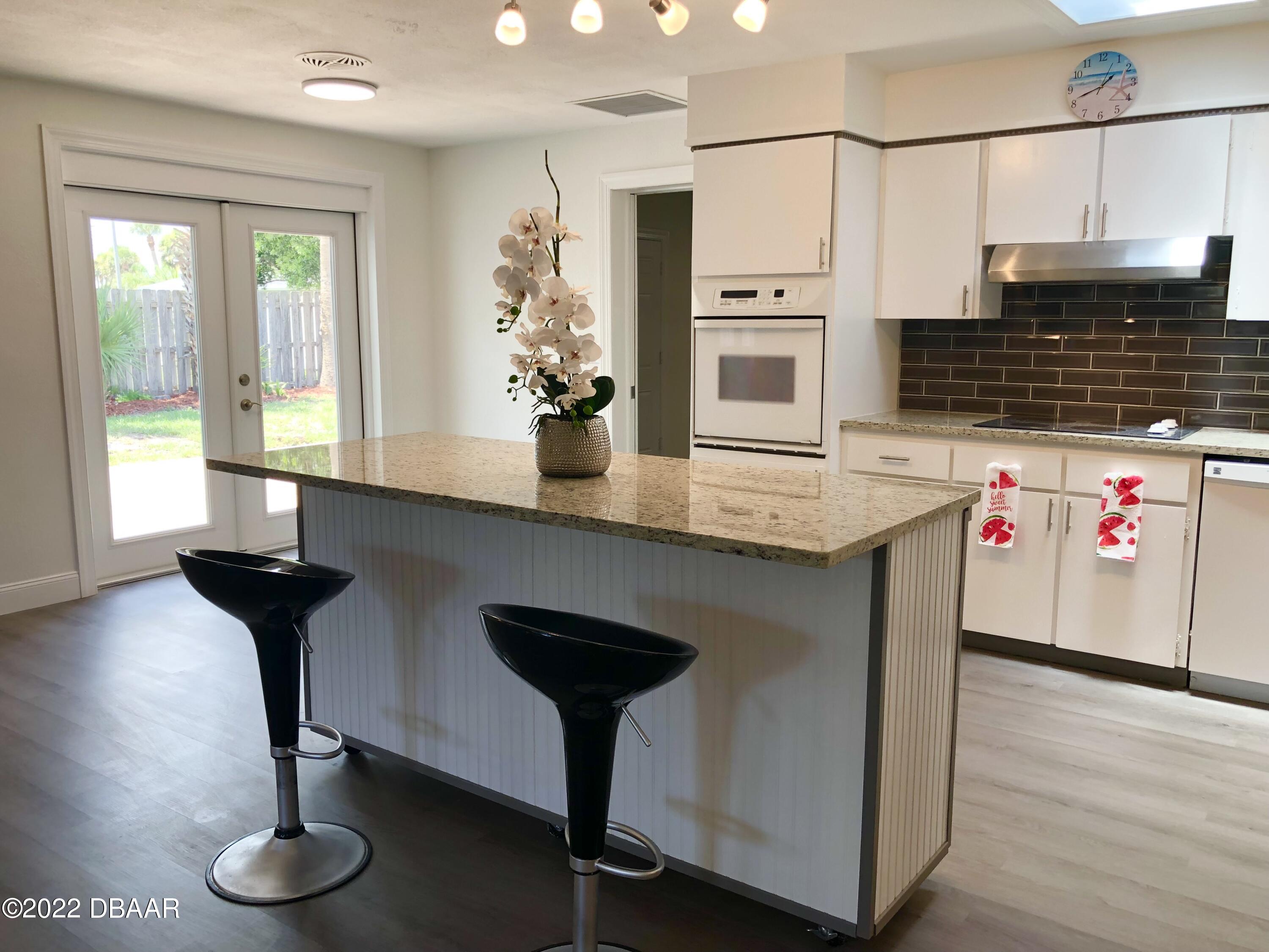 800 Marvin Road Ormond Beach, FL 32176 - Photo 6 of 33 Kitchen to patio