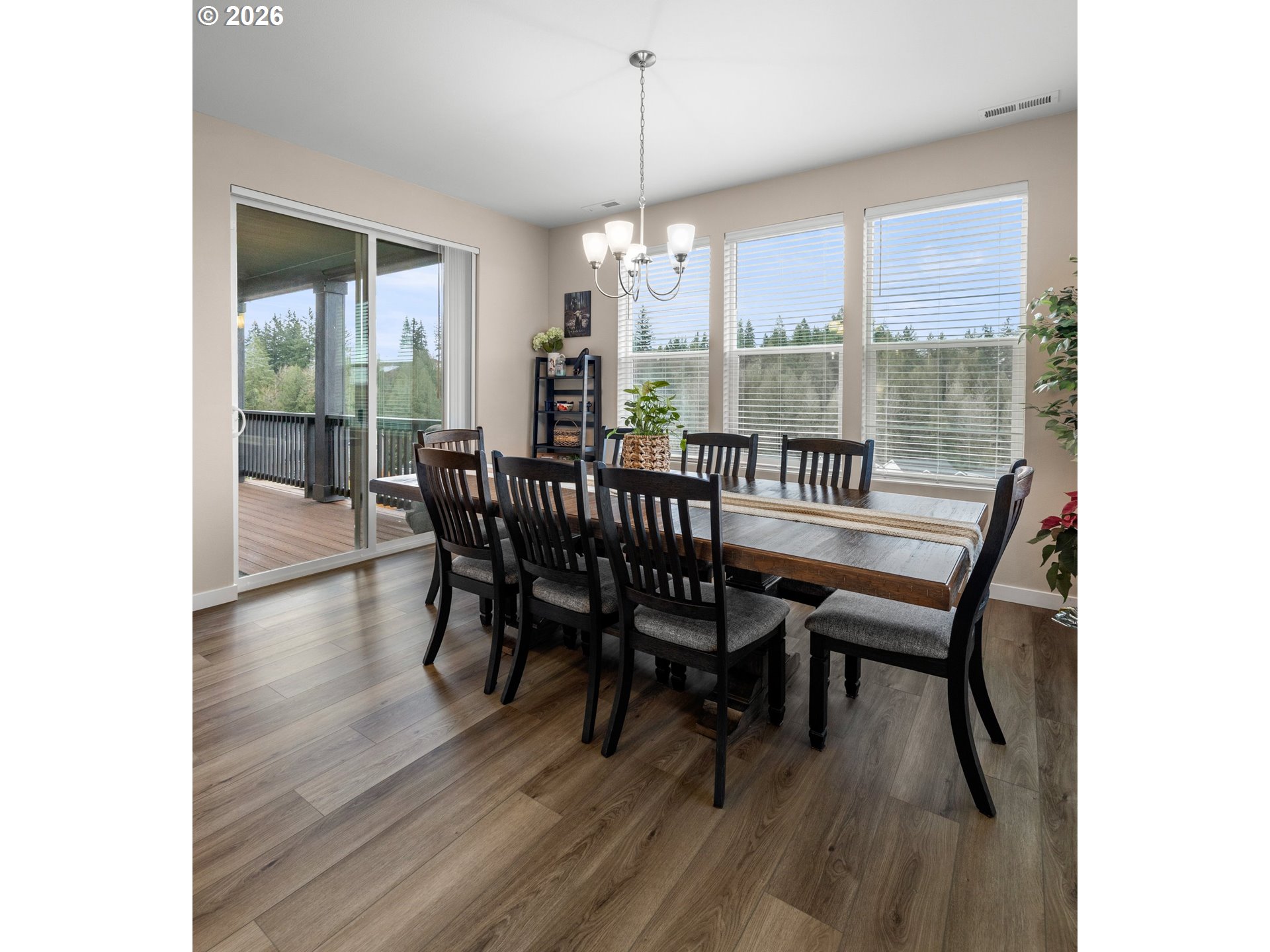 2081 Northeast Ridge Run Lane Estacada, OR 97023 - Photo 18 of 46 a view of a dining room with furniture window and wooden floor