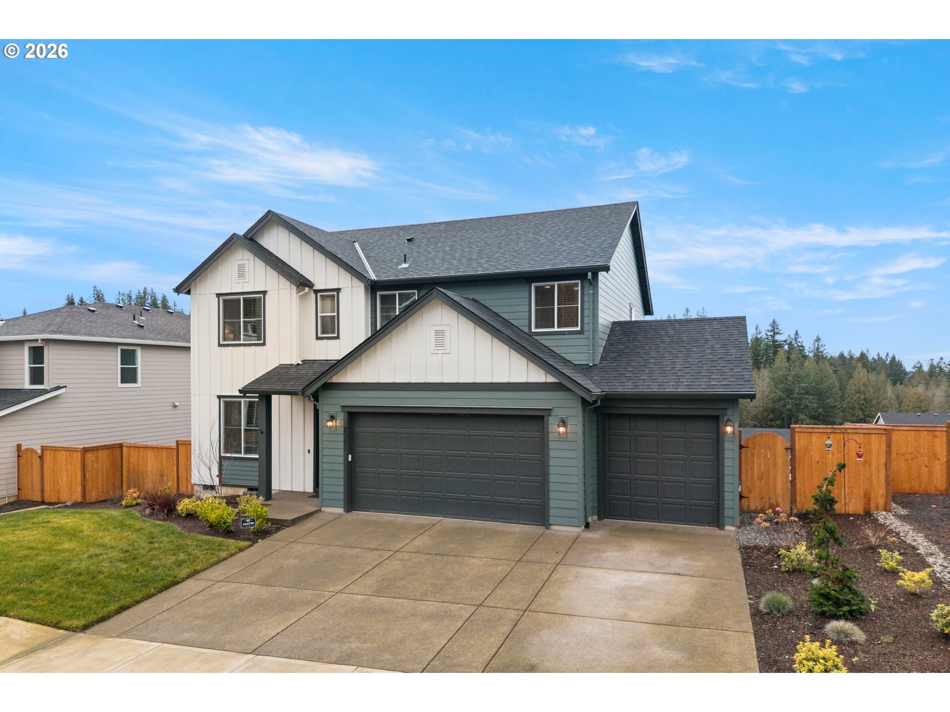 2081 Northeast Ridge Run Lane Estacada, OR 97023 - Photo 2 of 46 a front view of a house with a yard and garage