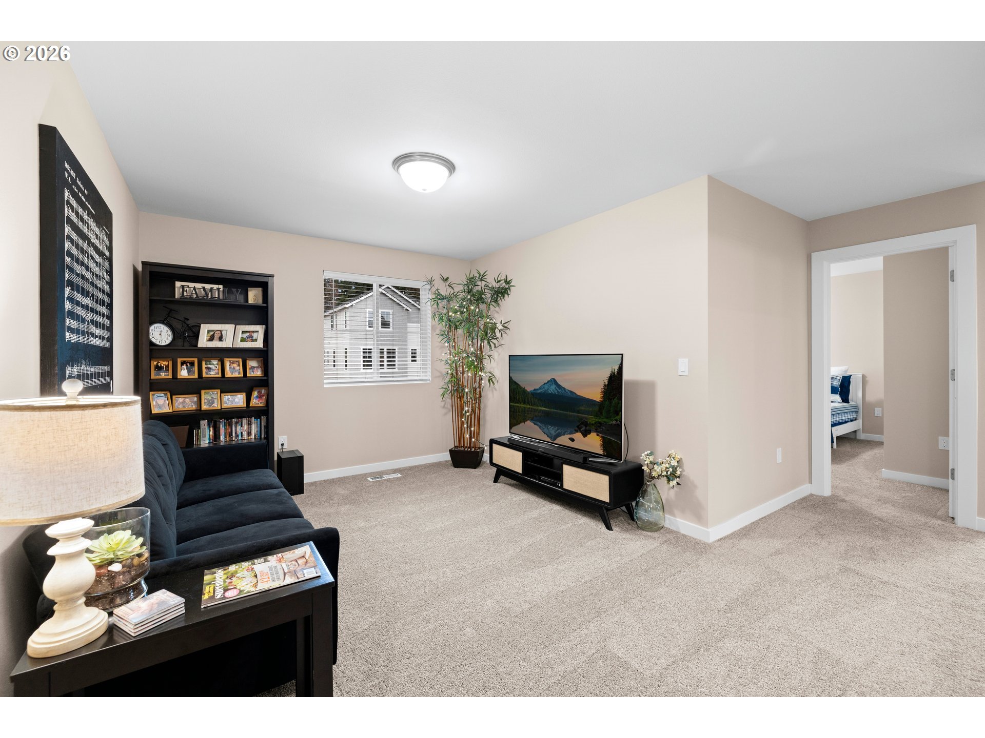 2081 Northeast Ridge Run Lane Estacada, OR 97023 - Photo 24 of 46 a living room with furniture a piano and a flat screen tv