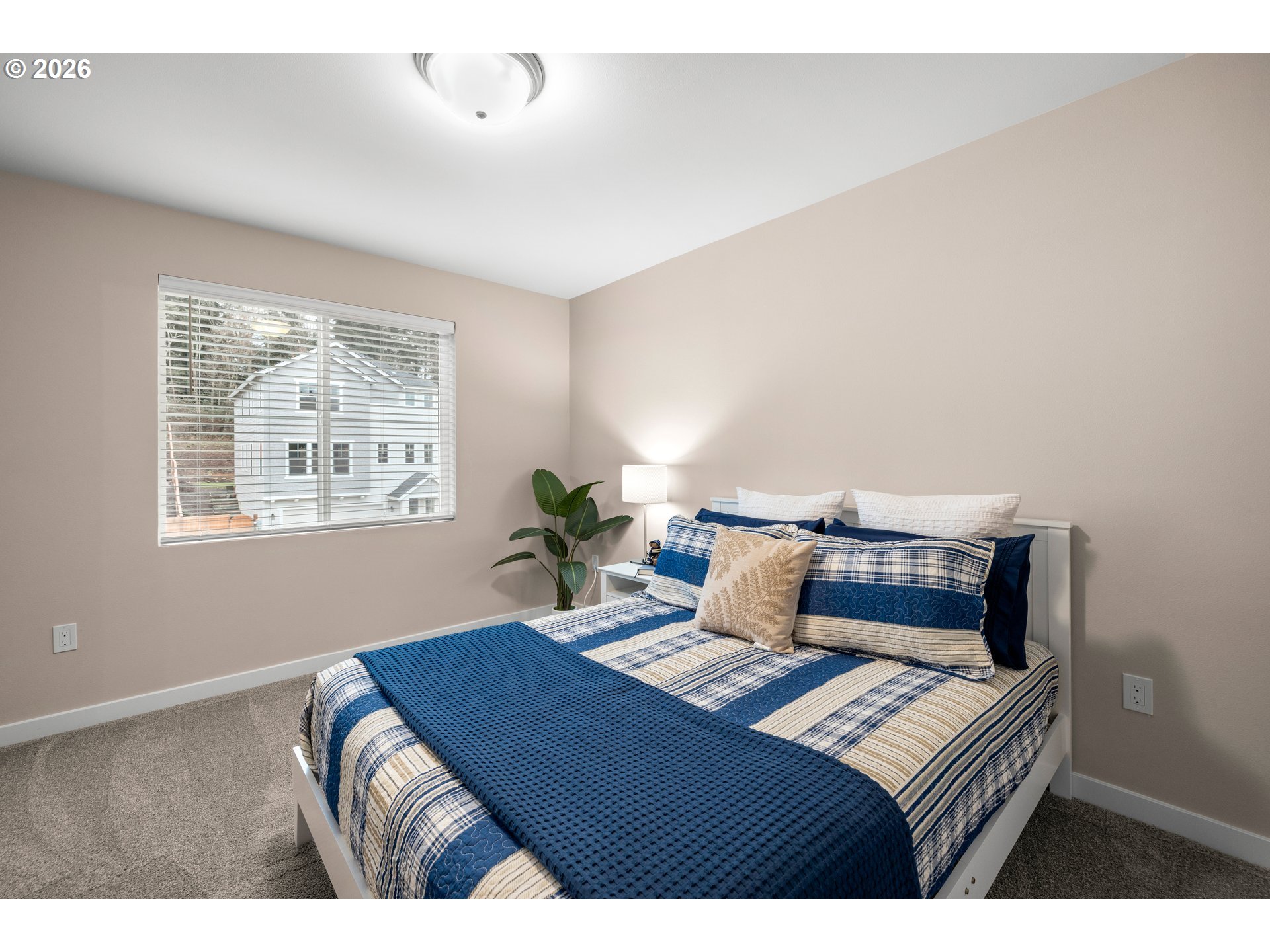 2081 Northeast Ridge Run Lane Estacada, OR 97023 - Photo 32 of 46 a bedroom with a bed table and window