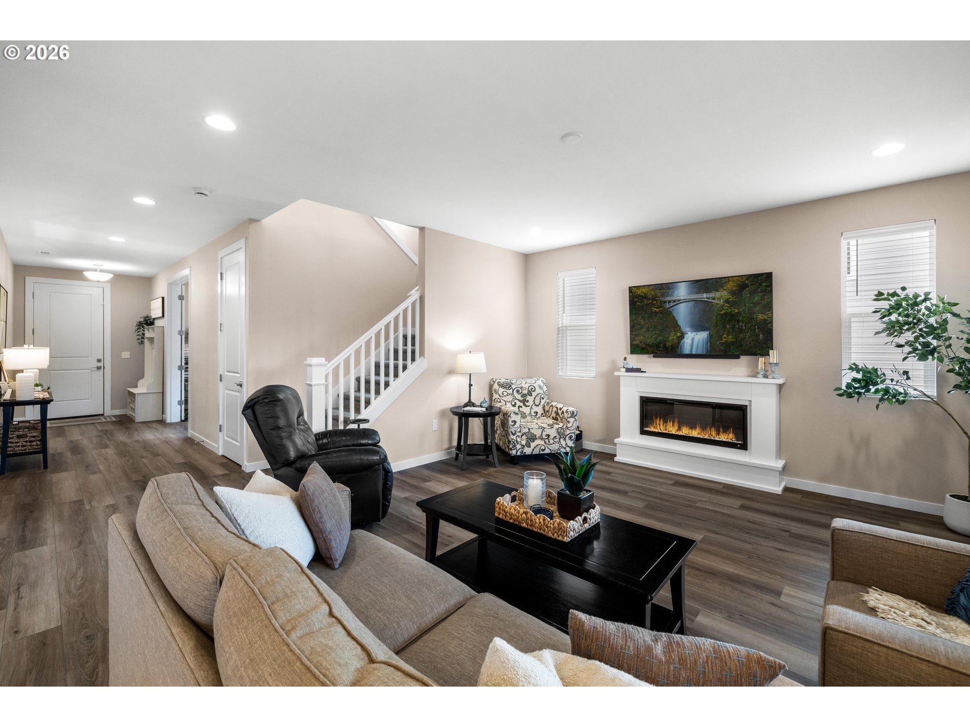 2081 Northeast Ridge Run Lane Estacada, OR 97023 - Photo 9 of 46 a living room with furniture a flat screen tv and a fireplace