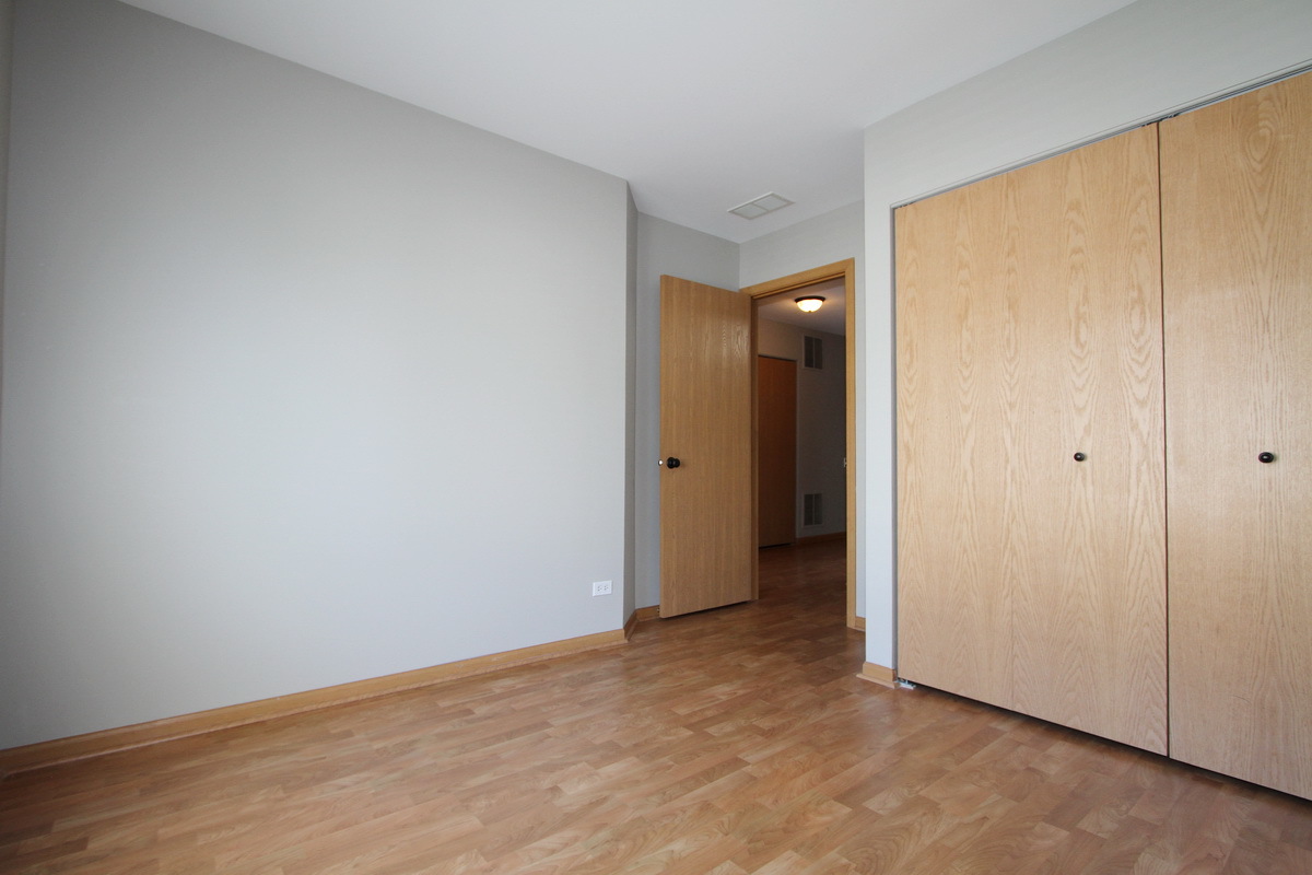 3159 Cambria Court Aurora, IL 60503 - Photo 15 of 20 a view of an empty room with wooden floor