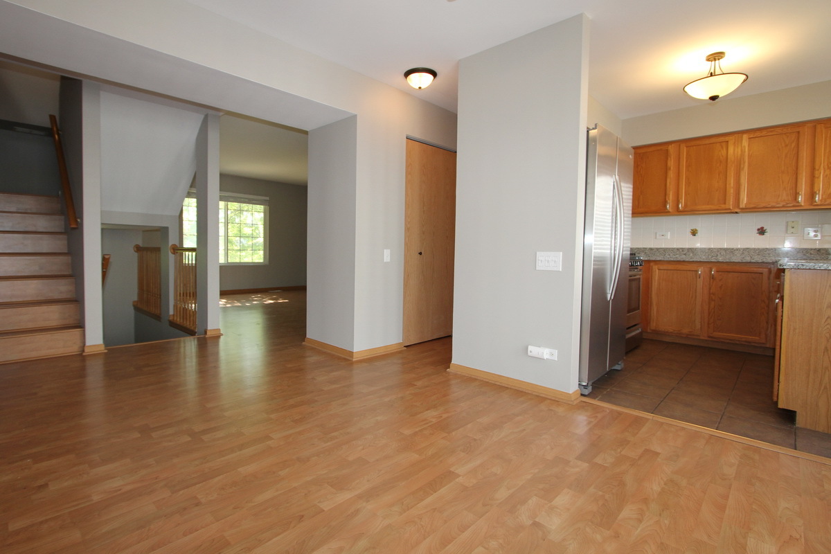 3159 Cambria Court Aurora, IL 60503 - Photo 5 of 20 a view of a kitchen with a sink and cabinets